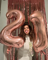 IWERP rose gold balloon backdrop elevates birthday celebrations gracefully.