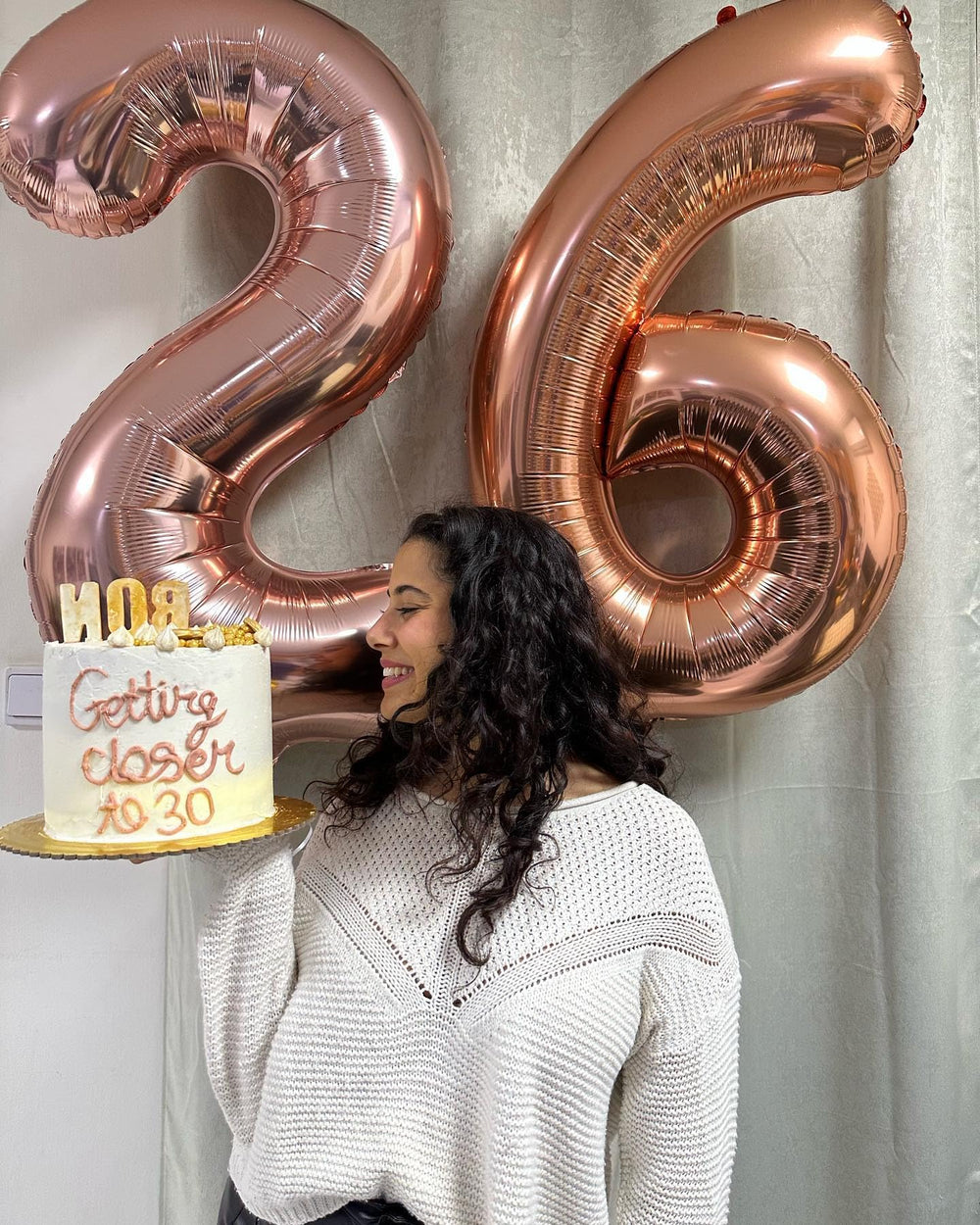 IWERP rose gold birthday balloon creates a focal backdrop for photos.