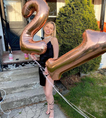 IWERP Rose Gold Number 21 balloon with rose-gold glow in photos.