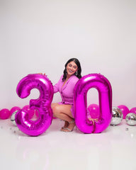 IWERP rosy purple balloon displayed on stage for photo moments.