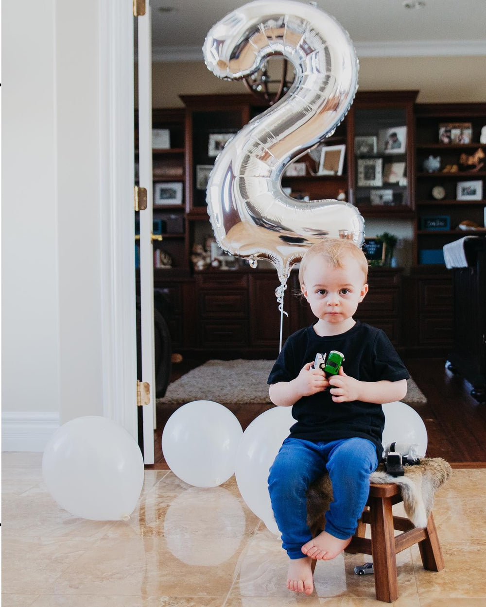 IWERP Silver foil balloon photo backdrop adds glam to a 40-inch milestone.