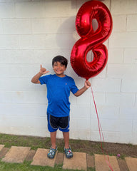 IWERP stage center backdrop features the red number 7 balloon.
