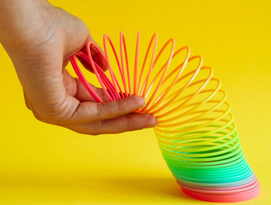 JA-RU rainbow coil toy ready to hop and entertain during stair play.