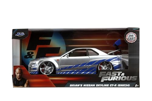 Side profile of Brian’s Skyline R34 highlights the sleek silver-blue finish for collectors.