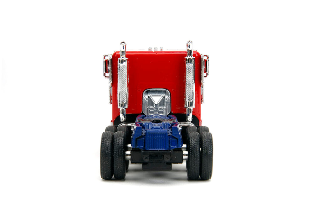 Jada Optimus Prime die-cast robot on chassis for dynamic display.