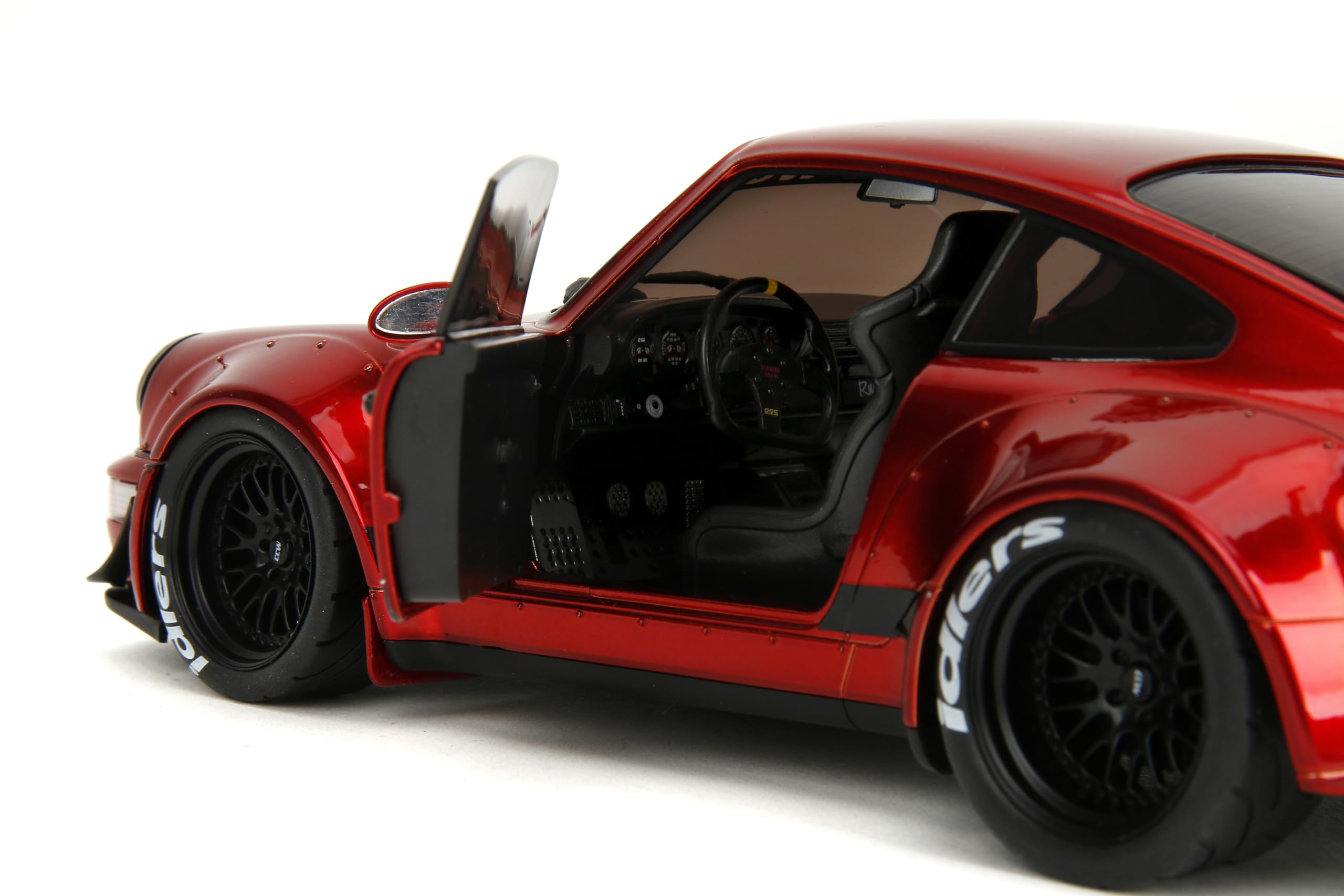 Jada Pink Slips Porsche RWB 964 wheel detail enhances realism with rubber tires.