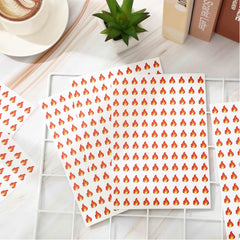 JarThenaAMCS orange fire sticker 0.5in on laptop lid for personalization