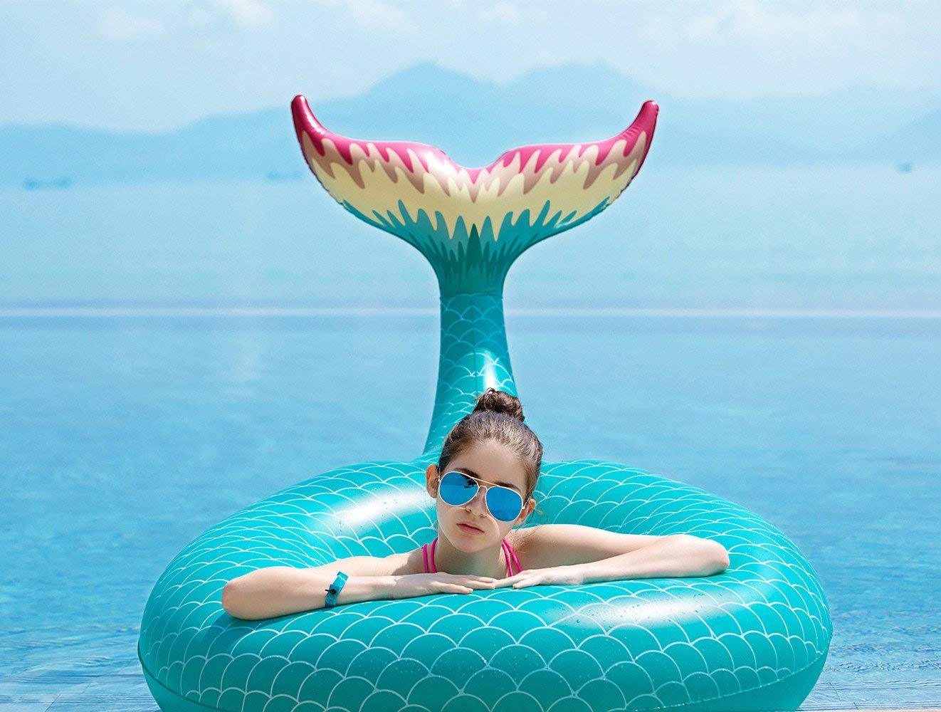 Mermaid tail float with fast valves for quick setup and deflation