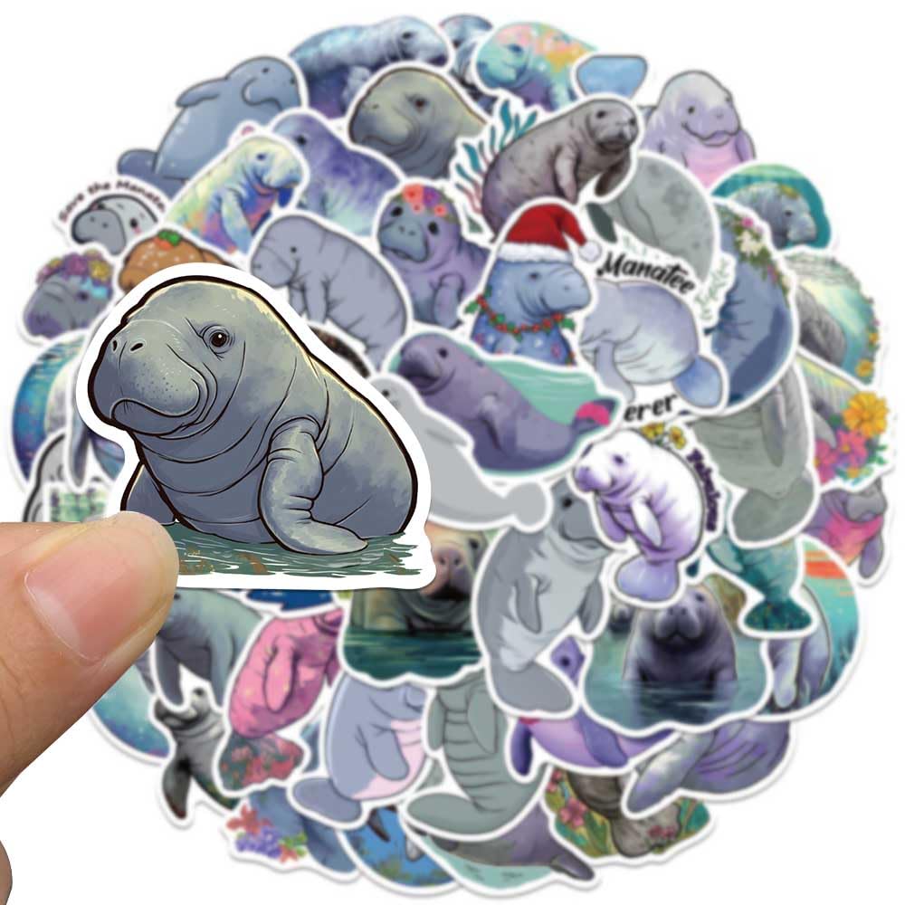 Jaurney Manatee stickers on a laptop with waterproof finish.