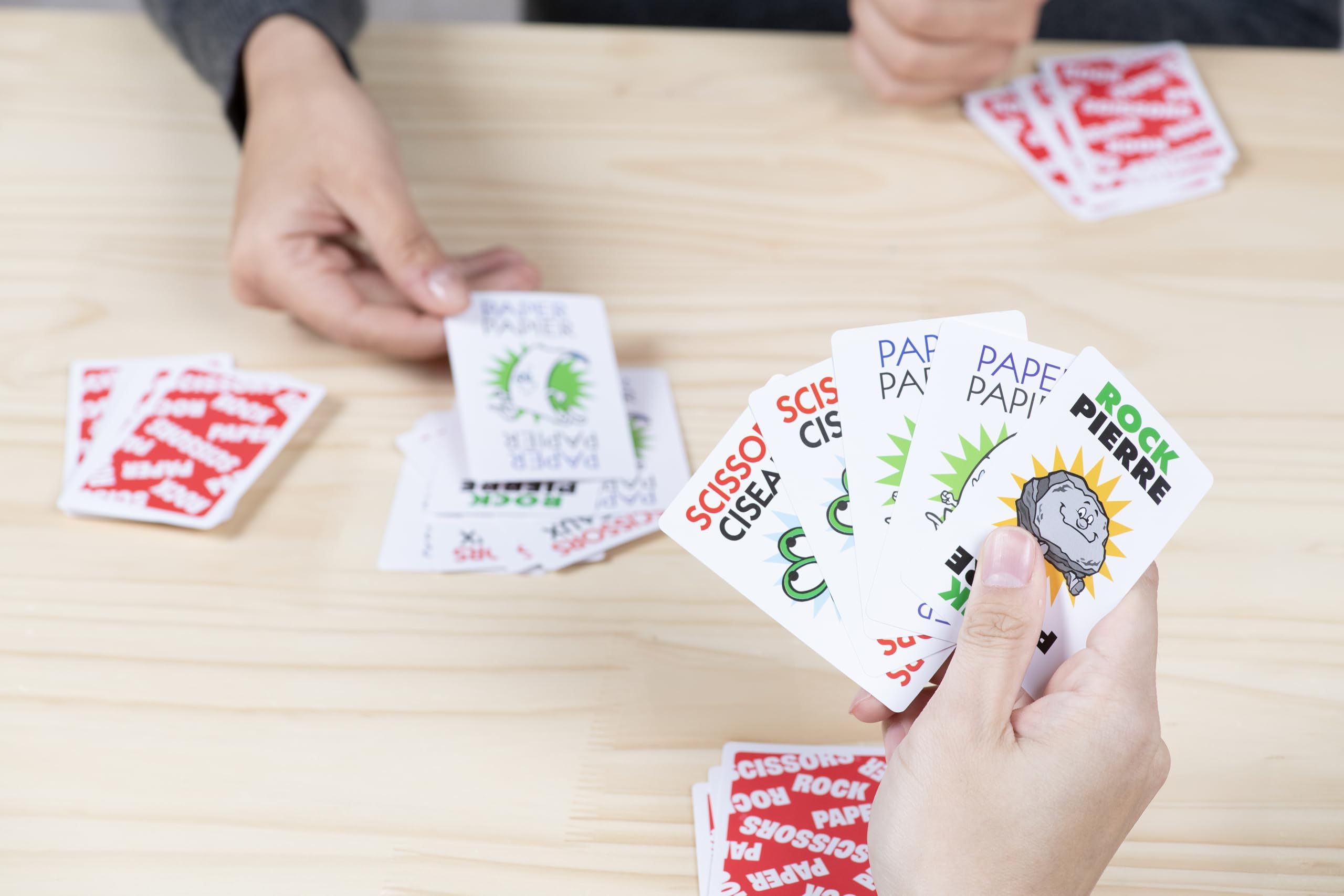 Vibrant artwork on JAX cards enhances family play sessions.