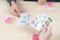 Vibrant artwork on JAX cards enhances family play sessions.