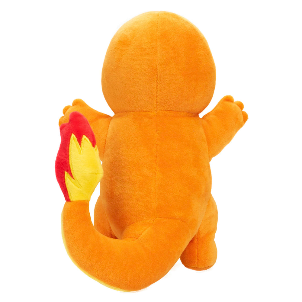 Jazwares Pokémon Charmander plush holding child, ideal Easter basket stuffer.