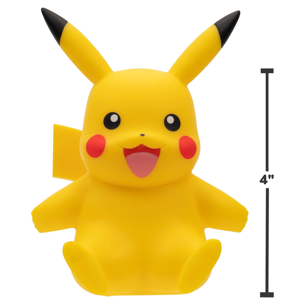 Jazwares Pikachu Select vinyl figure on desk alongside study aids.