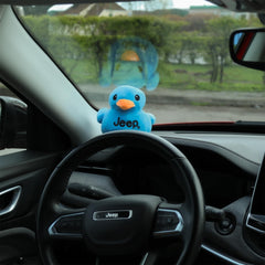 Jeep blue plush duck as part of a collector's display.