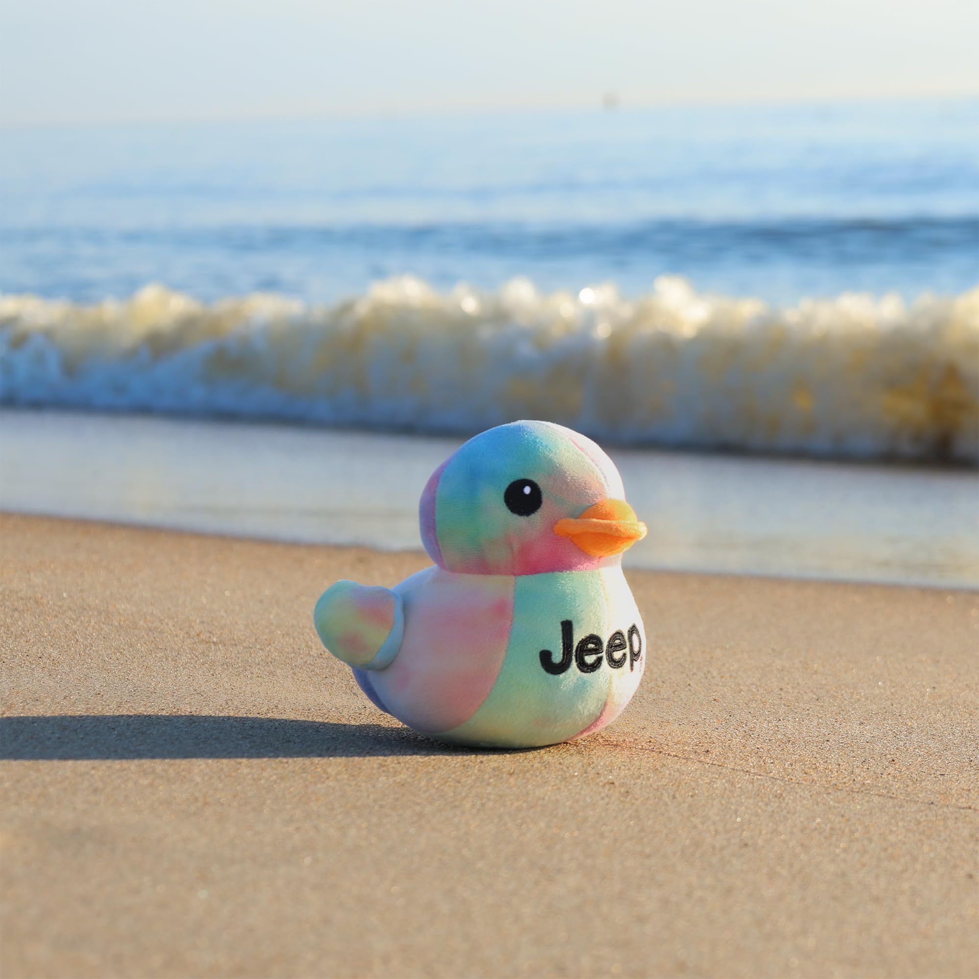 Jeep duck plush with vibrant tie-dye, ideal shelf display.