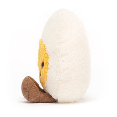 Jellycat Amuseables Boiled Egg Happy plush shows cinnamon cord feet for whimsy.