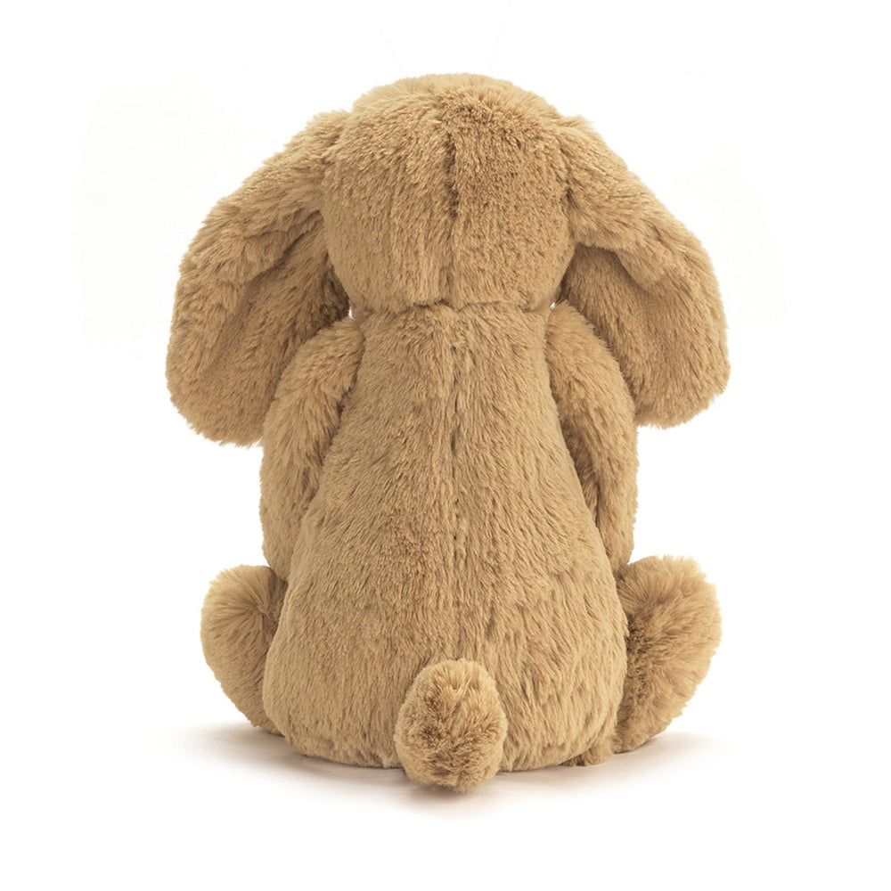 Jellycat Bashful Toffee Puppy sitting-height-9in demonstrates compact size for small hands.