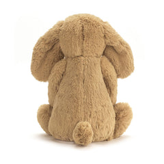 Jellycat Bashful Toffee Puppy sitting-height-9in demonstrates compact size for small hands.