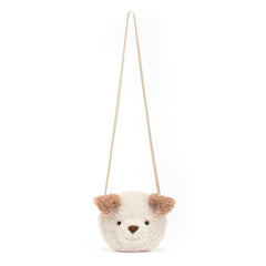 Jellycat Little Pup Bag worn crossbody supports hands-free outings and easy access.