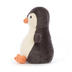 Jellycat Peanut Penguin face detail highlights the orange beak and friendly look.