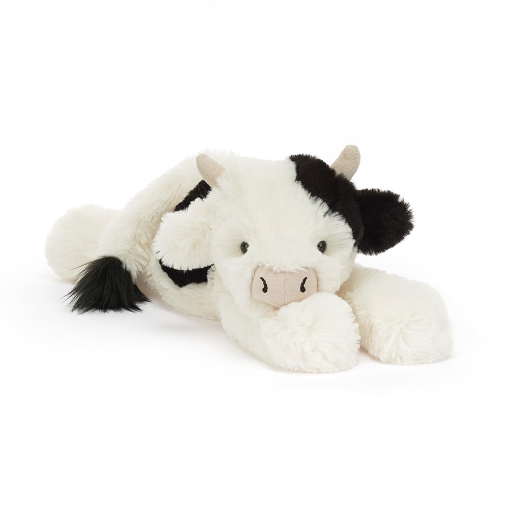 Jellycat Smudge Cow in golf-stance ready for imaginative play and cozy companionship