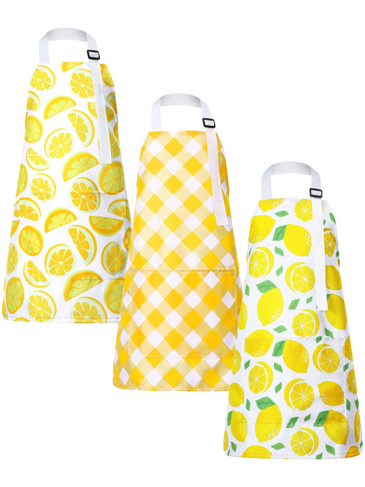 Jenaai lemon kids apron with green leaf design protects clothing during cooking and crafts.