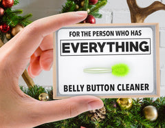 Jergrim belly button lint brush white elephant gift prompting conversation.