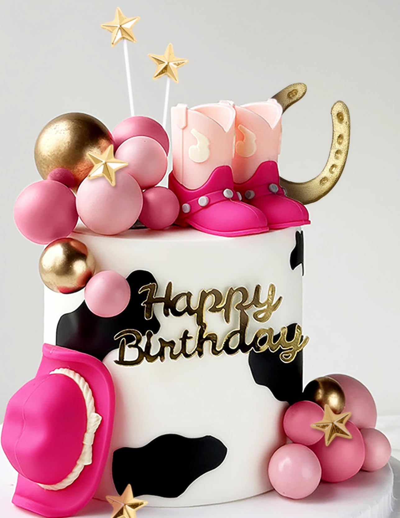 JeVenis pink cowgirl boots cake topper adds playful Western charm to celebrations.