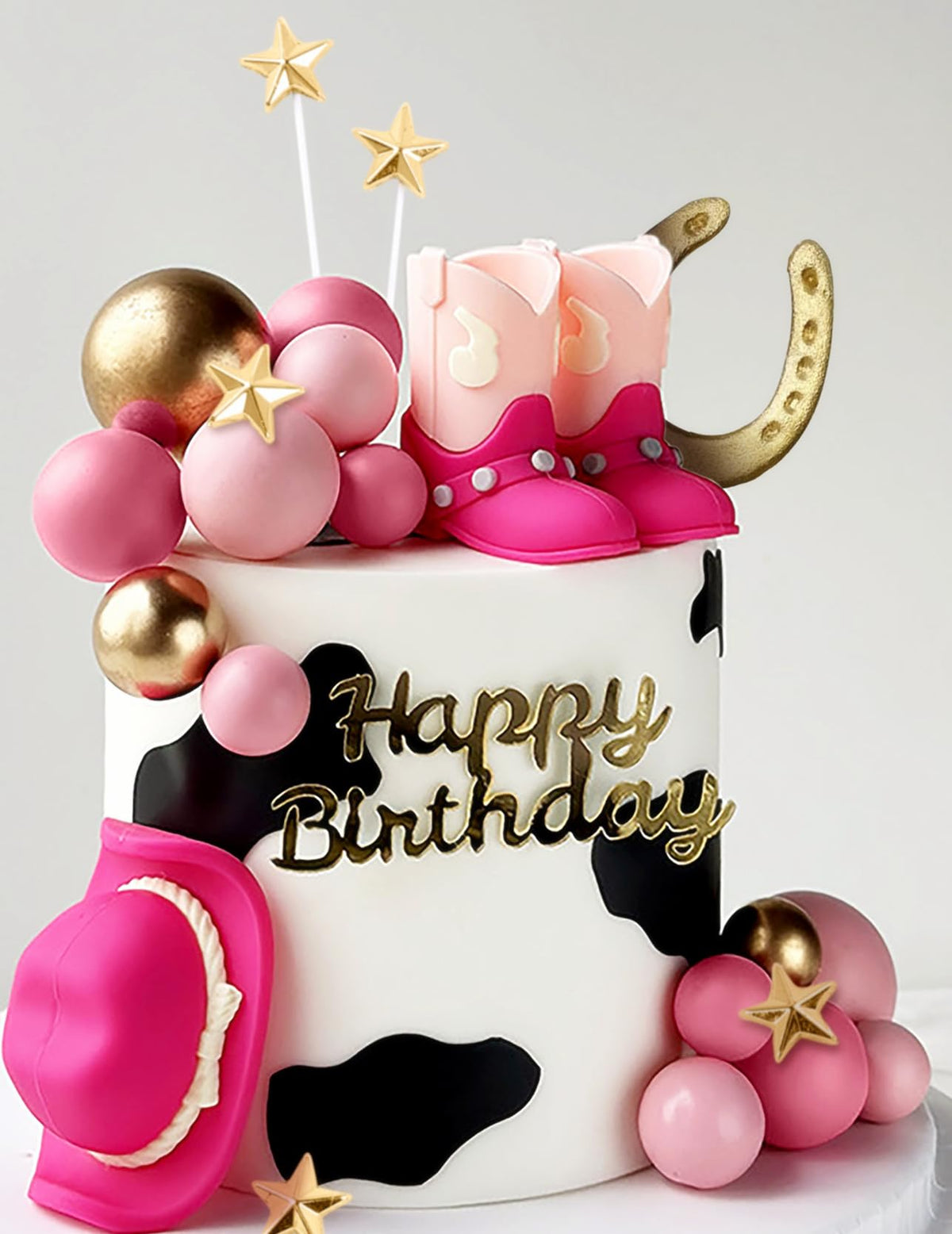 JeVenis pink cowgirl boots cake topper adds playful Western charm to celebrations.