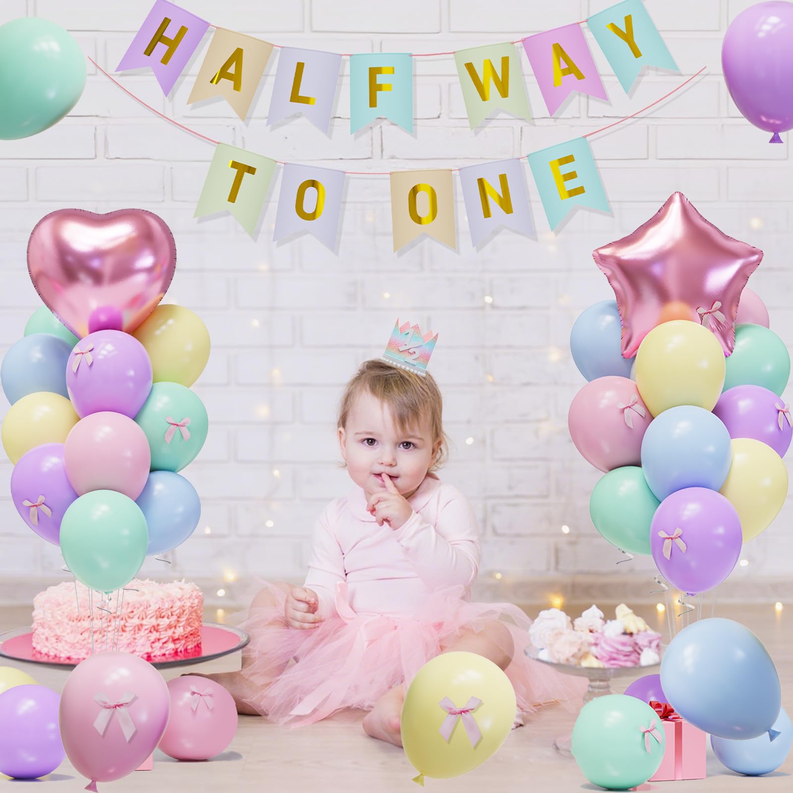 JIUENAGCN pink star foil balloon offers shimmering focal point for first birthday photos.
