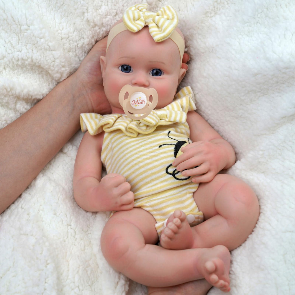 JIZHI doll with included outfit highlighting lifelike preemie clothing options.