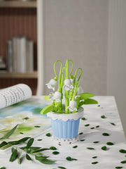Gift-ready Jollcnoia Lily of the Valley botanical blocks on display.