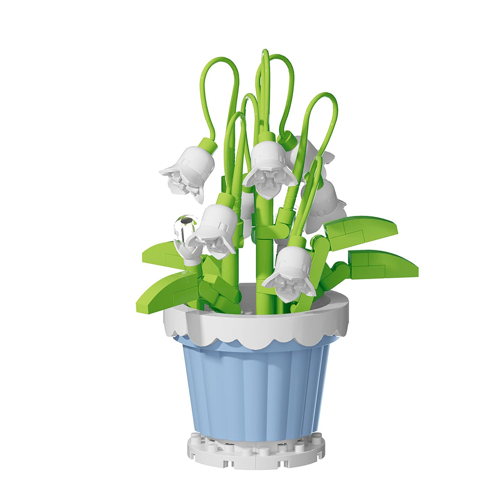 Jollcnoia Lily of the Valley mini bonsai blocks on a desk for calming decor.