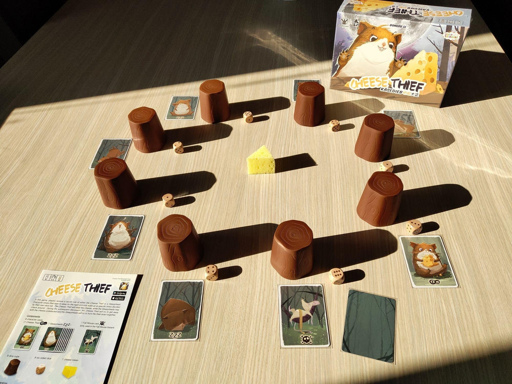 Jolly Thinkers Cheese Thief Game tree-trunk cups enhance table presence