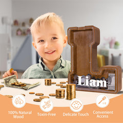 JOOMLAFLY wooden letter piggy bank side view showing clear savings panel.