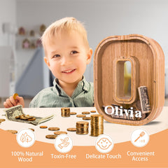 JOOMLAFLY 9-inch tall piggy bank with a natural wood finish.
