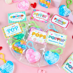 JOYIN Valentine's pop fidget keychain held in hand for on-the-go focus.