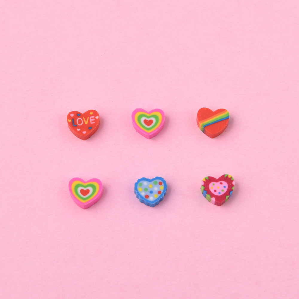 Jsehchya adorable heart erasers in use as fun stationery companions.