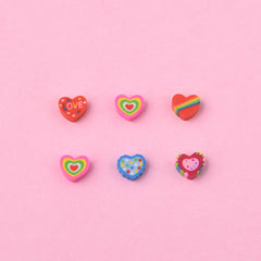 Jsehchya adorable heart erasers in use as fun stationery companions.