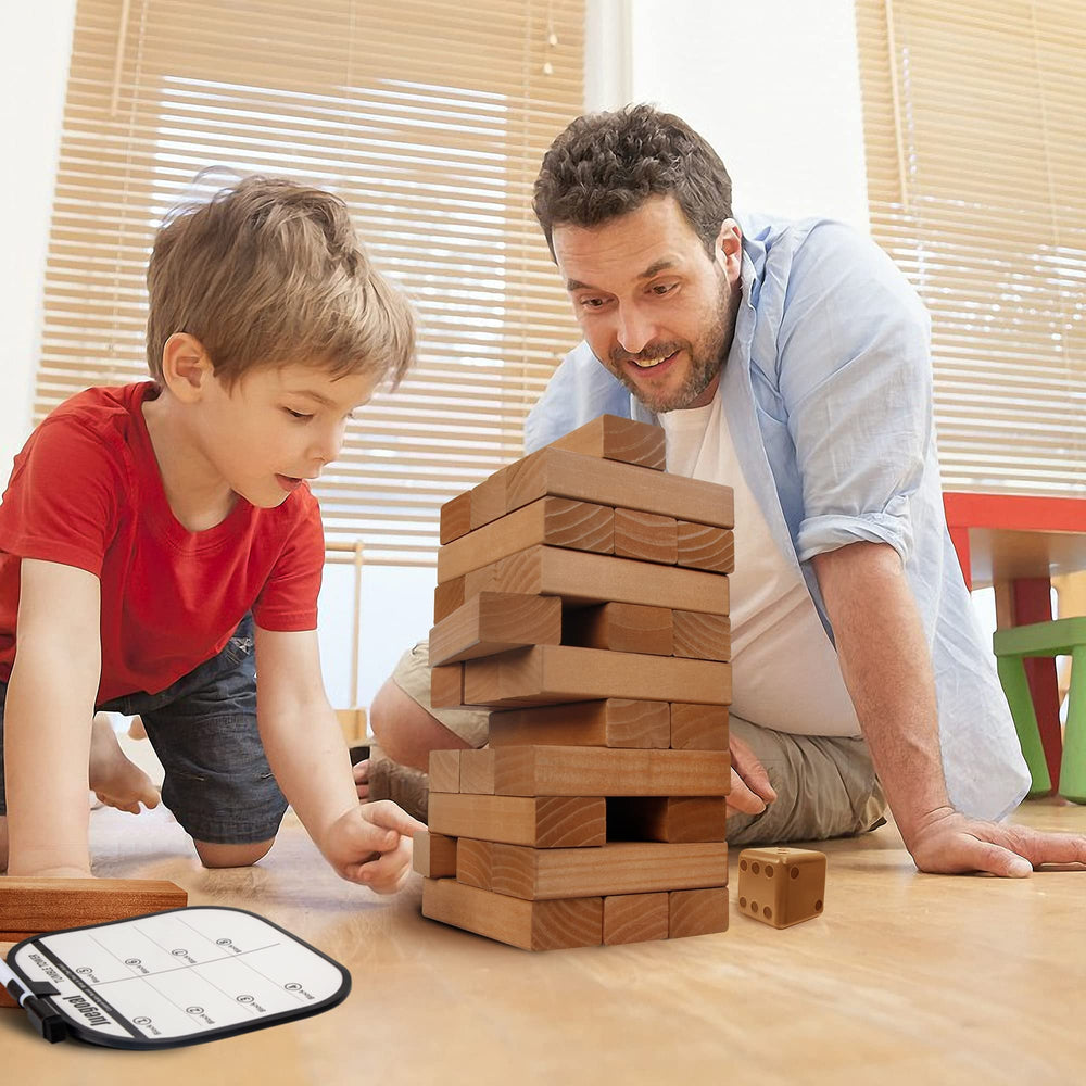 Juegoal family playing giant tower outdoors on a sunny day.