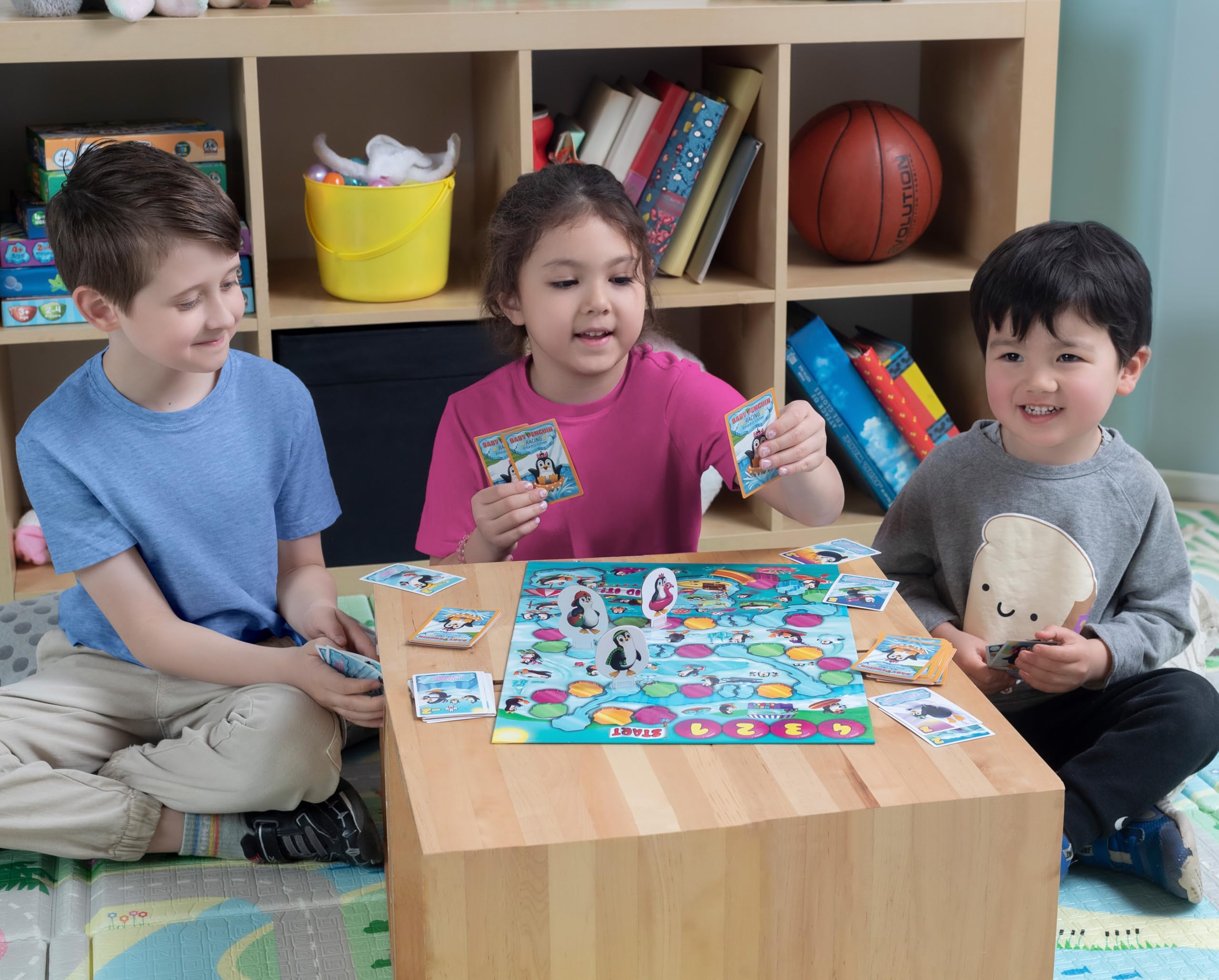Kids practice counting and early strategy during penguin race setup