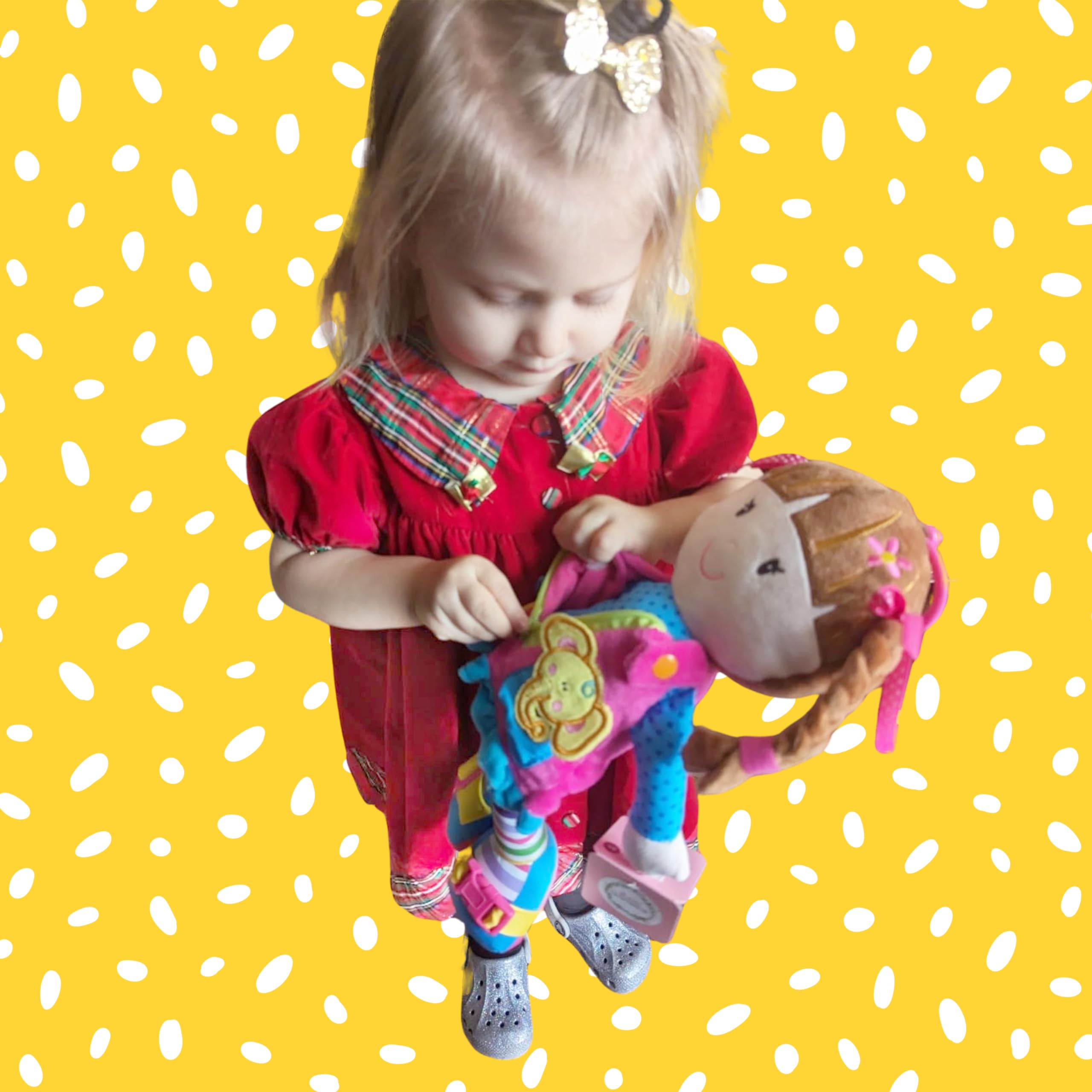 June Garden Dressy Friends Belle buttoning parts promoting tactile attention and sequence learning.