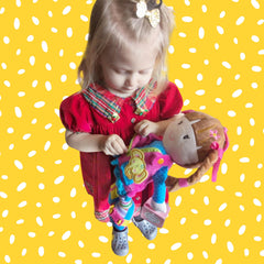 June Garden Dressy Friends Belle buttoning parts promoting tactile attention and sequence learning.