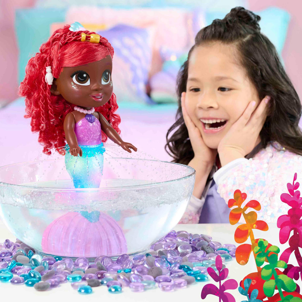 Ariel’s tail submerged in water triggers a color-changing light show and fountain-like spray.