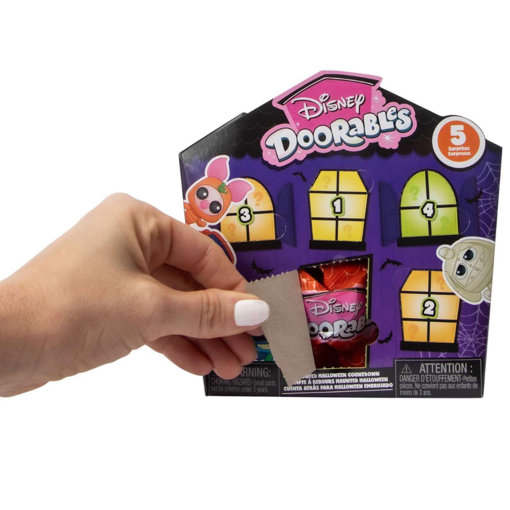 Sticker included in Just Play Disney Doorables Halloween Edition enhances themed storytelling.