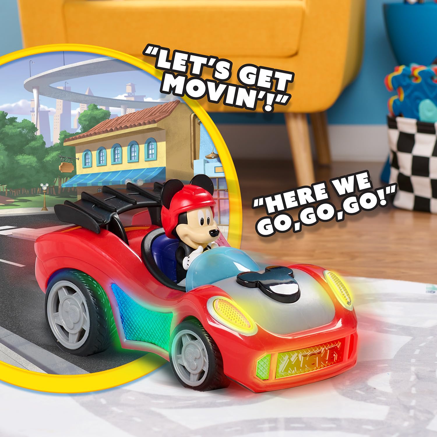 Just Play Mickey Mouse Rev 'n Glow Racer Mickey sits in the driver's seat for familiar roleplay.