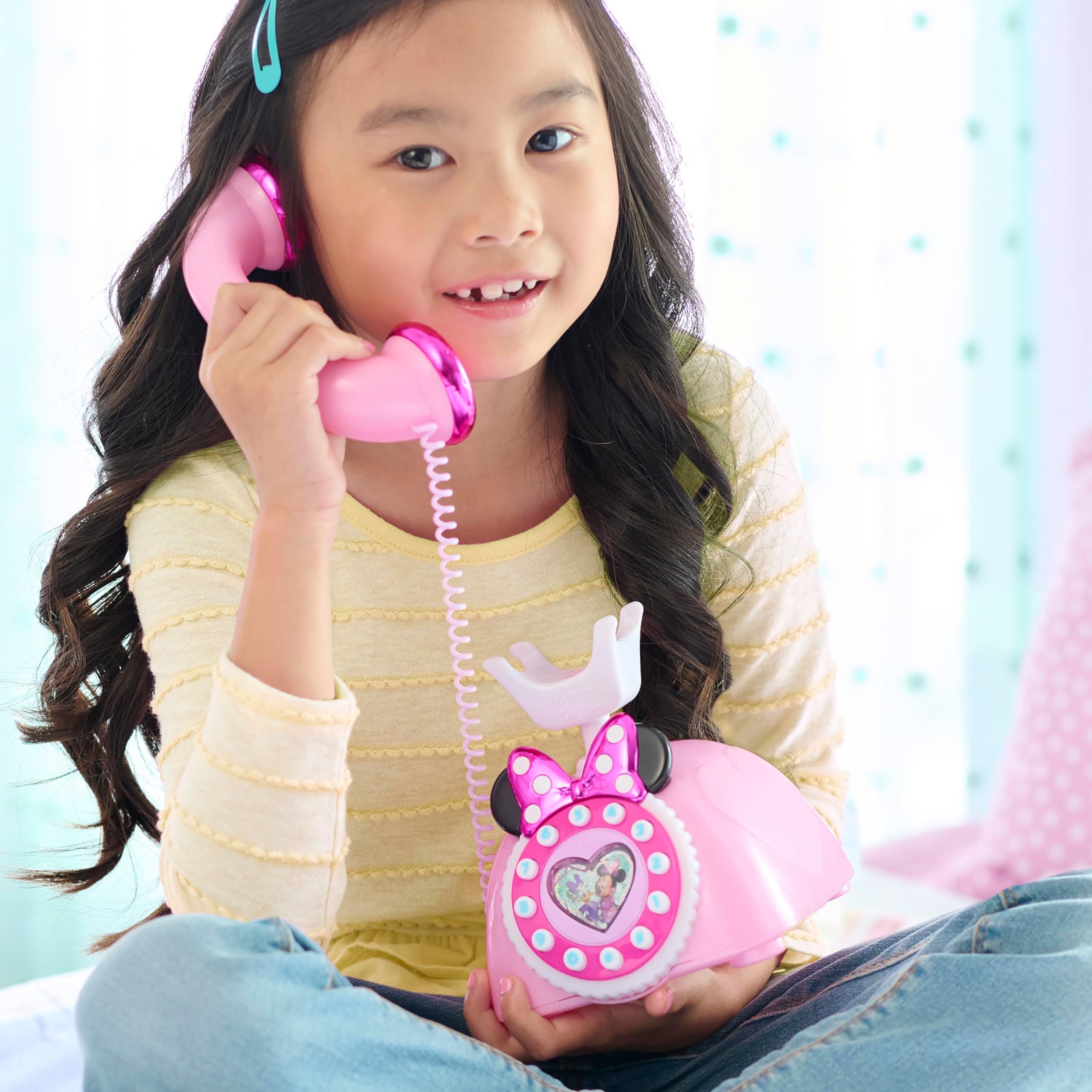 Just Play Minnie Mouse Ring Me Rotary Phone with ears and polka-dot bow, perfect for pretend play.