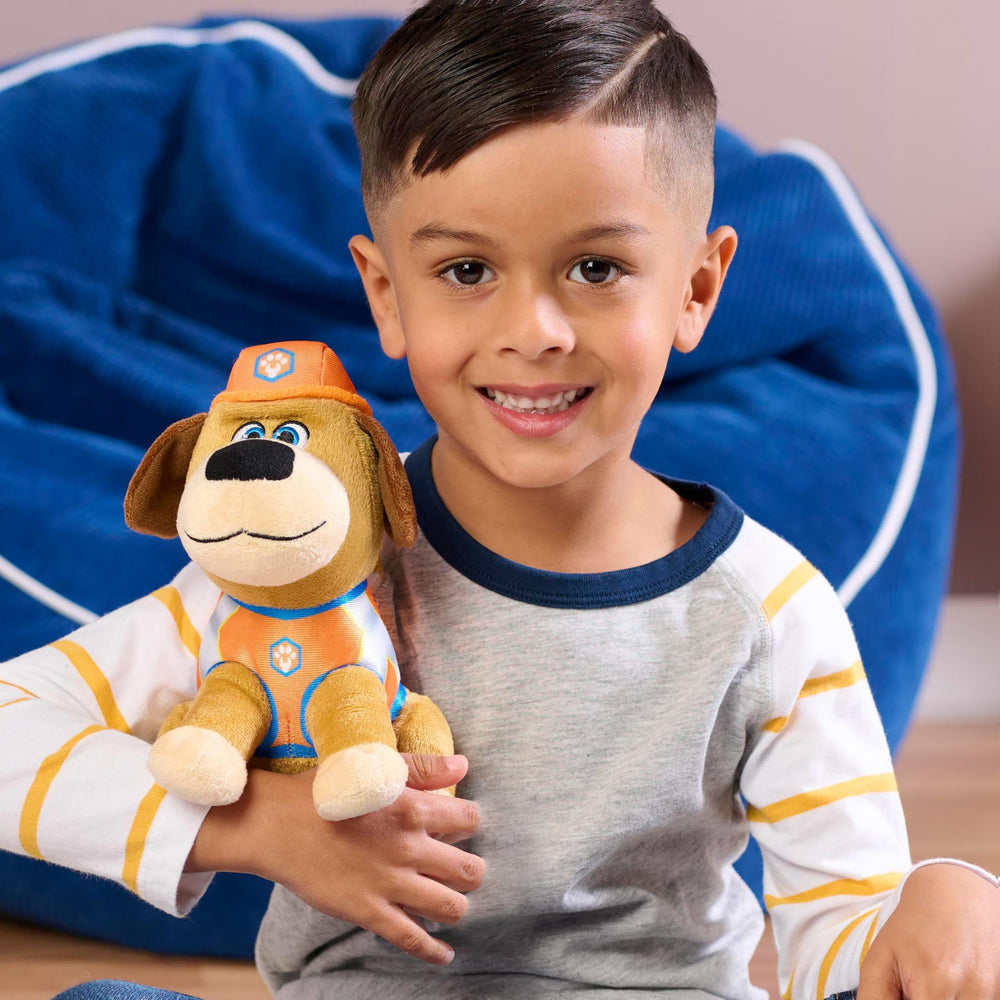 Just Play Pupstruction Tank plush side view highlighting orange construction uniform for imaginative play.