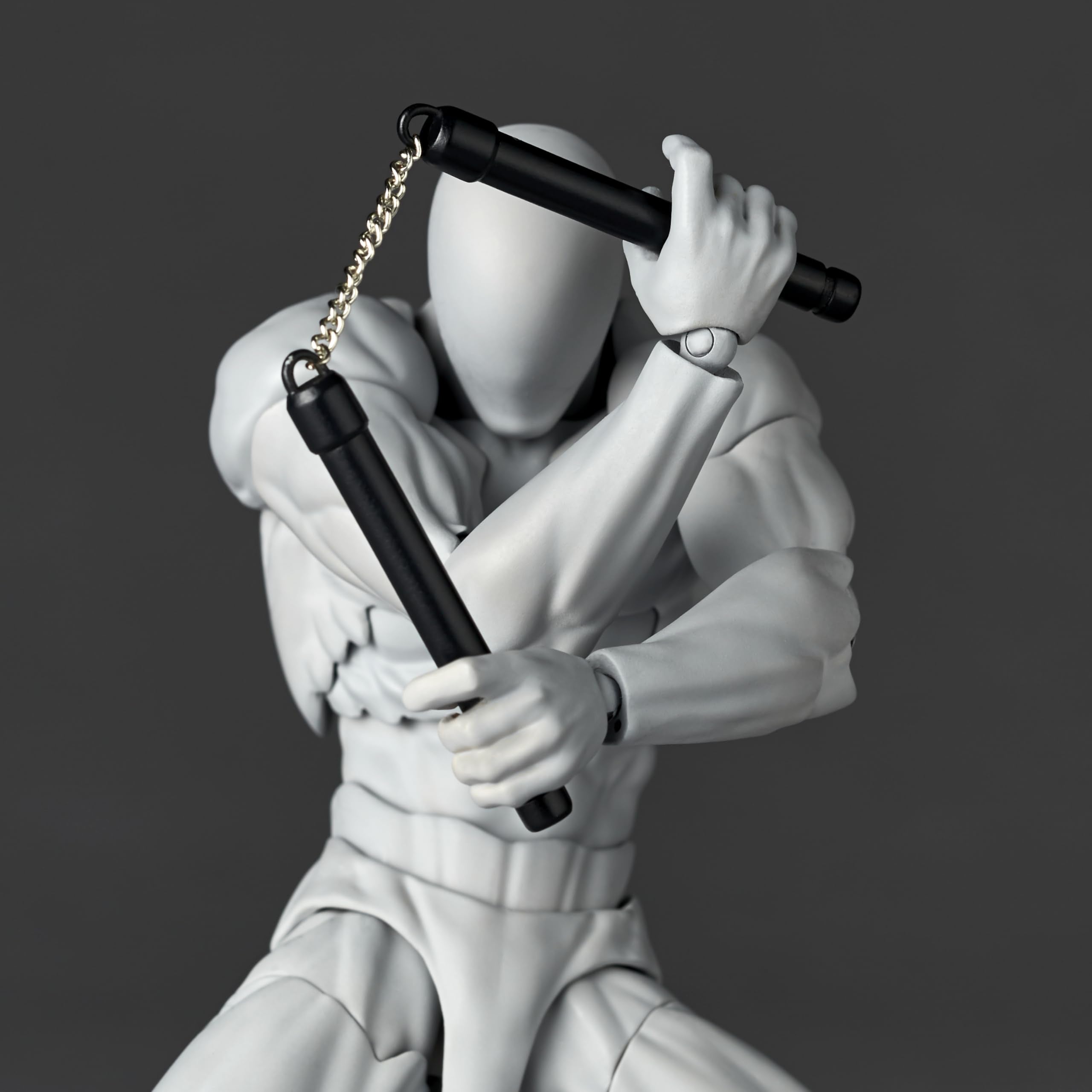 Kaiyodo Revoltech Volume 2 stun gun for dramatic accessory shots.