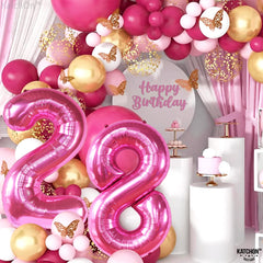 KatchOn giant number 28 balloon in pink adds wow factor to the setup.